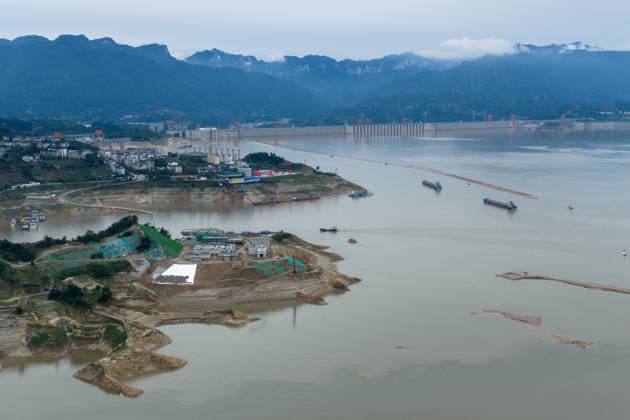 (260608) -- YICHANG, June 8, 2026 -- An aerial drone photo taken on June 8, 2026 shows the construction site of a new ship lock and its approach channels of the Three Gorges new waterway project in Yichang, central China s Hubei Province. China on Monday began construction of a mega waterway project, including what is expected to become the world s largest inland ship lock, in response to the rising shipping demand along the Yangtze, the world s third-longest river. The 77.2-billion-yuan (about 11.3 billion U.S. dollars) project will add a five-tier, dual-track ship lock north of the existing lock at the Three Gorges Dam, the world s largest water conservancy project, and upgrade navigation facilities at a smaller downstream dam. The