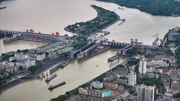 (260608) -- YICHANG, June 8, 2026 -- An aerial drone photo taken on June 8, 2026 shows the upgrading site of navigation facilities at Gezhouba in Yichang, central China s Hubei Province. China on Monday began construction of a mega waterway project, including what is expected to become the world s largest inland ship lock, in response to the rising shipping demand along the Yangtze, the world s third-longest river. The 77.2-billion-yuan (about 11.3 billion U.S. dollars) project will add a five-tier, dual-track ship lock north of the existing lock at the Three Gorges Dam, the world s largest water conservancy project, and upgrade navigation facilities at a smaller downstream dam. The new ship lock and its approach channels, which toge