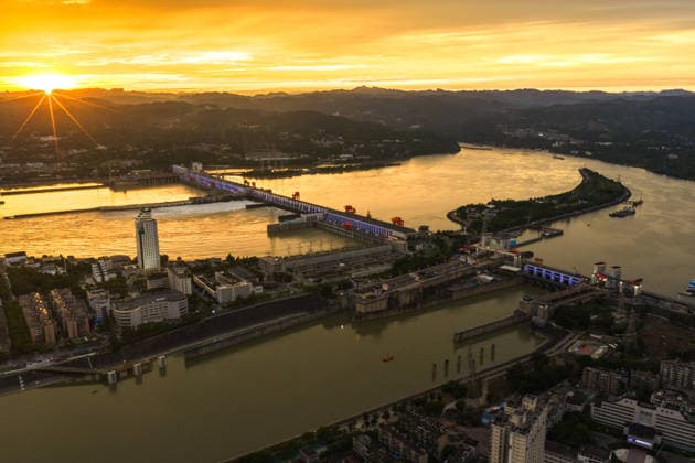 (260608) -- YICHANG, June 8, 2026 -- An aerial drone photo taken on June 8, 2026 shows the upgrading site of navigation facilities at Gezhouba in Yichang, central China s Hubei Province. China on Monday began construction of a mega waterway project, including what is expected to become the world s largest inland ship lock, in response to the rising shipping demand along the Yangtze, the world s third-longest river. The 77.2-billion-yuan (about 11.3 billion U.S. dollars) project will add a five-tier, dual-track ship lock north of the existing lock at the Three Gorges Dam, the world s largest water conservancy project, and upgrade navigation facilities at a smaller downstream dam. The new ship lock and its approach channels, which toge
