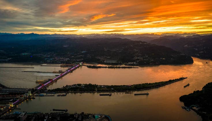 (260608) -- YICHANG, June 8, 2026 -- An aerial drone photo taken on June 8, 2026 shows the upgrading site of navigation facilities at Gezhouba in Yichang, central China s Hubei Province. China on Monday began construction of a mega waterway project, including what is expected to become the world s largest inland ship lock, in response to the rising shipping demand along the Yangtze, the world s third-longest river. The 77.2-billion-yuan (about 11.3 billion U.S. dollars) project will add a five-tier, dual-track ship lock north of the existing lock at the Three Gorges Dam, the world s largest water conservancy project, and upgrade navigation facilities at a smaller downstream dam. The new ship lock and its approach channels, which toge
