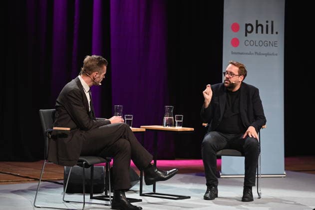 Cabaret artist Florian Schroeder, l r, and journalist Paul Ronzheimer speak at Phil Cologne, an international festival of philosophy