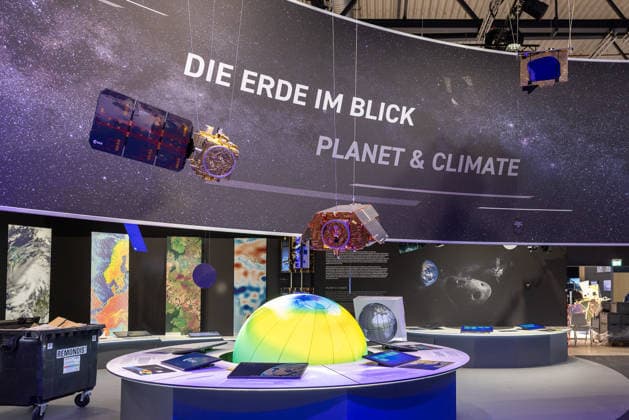 Press tour at ILA Berlin 2026, Berlin, 09 06 2026 Exhibition stand of the ESA European Space Agency with the theme Earth at a glance Planet Climate Hanging satellite models, large-format earth observation images and an illuminated earth model characterize the presentation 20260609-286A8875-M4000