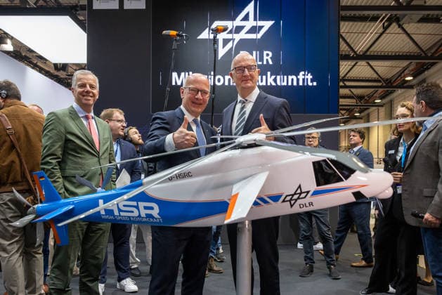 Press tour at the ILA Berlin 2026, Berlin, 09 06 2026 Dietmar Woidke, Minister President of the State of Brandenburg, right, and Kai Wegner, Governing Mayor of Berlin Mitte, and Martin Kroell BDLI SME Representative, Treasurer CEO AUTOFLUG GmbH at the DLR stand in front of the model of the High Speed Rotorcraft HSR 20260609-286A8988-M4000