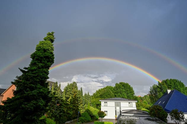 Germany, Schleswig Holstein, Wedel, 09 06 2026 After a heavy downpour a double rainbow appears over Wedel Schleswig Holstein Rainbow over Wedel