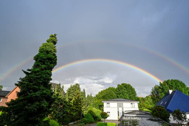 Germany, Schleswig Holstein, Wedel, 09 06 2026 After a heavy downpour a double rainbow appears over Wedel Schleswig Holstein Rainbow over Wedel