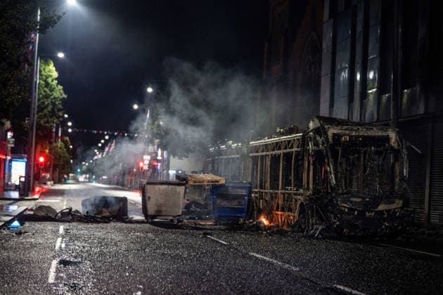 June 9, 2026, Belfast, Antrim, United Kingdom: A burnt out bus seen after an anti-immigration protest. Belfast erupted into flames as locals took to the streets to protest against the stabbing of a North Belfast man by a Sudanese national refugee. Road blockades were set up all over Belfast bringing much of the city to a standstill. The protestors are demanding a stop to immigration into Northern Ireland. Belfast United Kingdom - ZUMAs197 20260609_aaa_s197_269 Copyright: xLabxMox