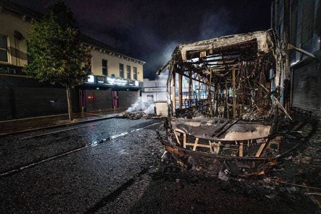 June 9, 2026, Belfast, Antrim, United Kingdom: A burnt out bus seen after an anti-immigration protest. Belfast erupted into flames as locals took to the streets to protest against the stabbing of a North Belfast man by a Sudanese national refugee. Road blockades were set up all over Belfast bringing much of the city to a standstill. The protestors are demanding a stop to immigration into Northern Ireland. Belfast United Kingdom  - ZUMAs197 20260609_aaa_s197_277 Copyright: xLabxMox