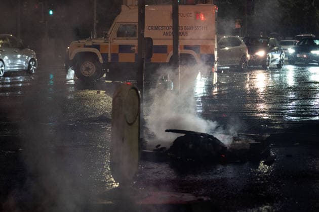 June 9, 2026, Belfast, Antrim, United Kingdom: Police van drives past a blockaded road during the rally. Belfast erupted into flames as locals took to the streets to protest against the stabbing of a North Belfast man by a Sudanese national refugee. Road blockades were set up all over Belfast bringing much of the city to a standstill. The protestors are demanding a stop to immigration into Northern Ireland. Belfast United Kingdom  - ZUMAs197 20260609_aaa_s197_282 Copyright: xLabxMox
