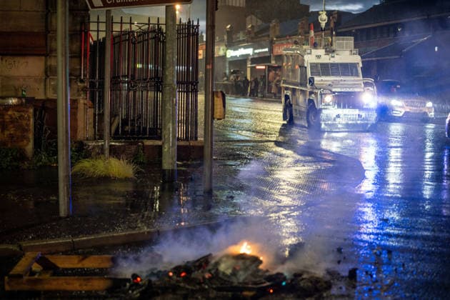 June 9, 2026, Belfast, Antrim, United Kingdom: Police van drives past a blocked road. Belfast erupted into flames as locals took to the streets to protest against the stabbing of a North Belfast man by a Sudanese national refugee. Road blockades were set up all over Belfast bringing much of the city to a standstill. The protestors are demanding a stop to immigration into Northern Ireland. Belfast United Kingdom  - ZUMAs197 20260609_aaa_s197_283 Copyright: xLabxMox