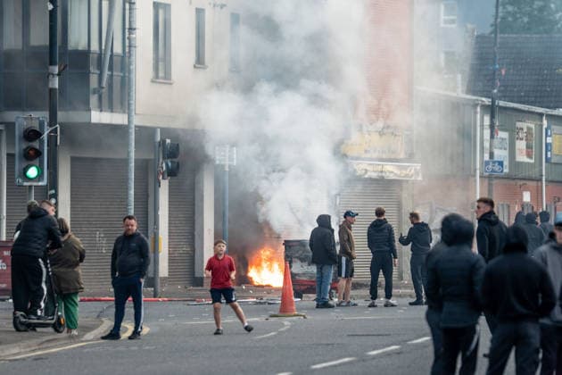 June 9, 2026, Belfast, Antrim, United Kingdom: Belfast youths burn down a grocery store owned by an immigrant. Belfast erupted into flames as locals took to the streets to protest against the stabbing of a North Belfast man by a Sudanese national refugee. Road blockades were set up all over Belfast bringing much of the city to a standstill. The protestors are demanding a stop to immigration into Northern Ireland. Belfast United Kingdom - ZUMAs197 20260609_aaa_s197_285 Copyright: xLabxMox