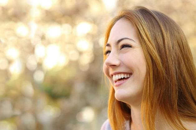 Facial portrait of a funny woman face laughing with a warmth background model released Symbolfoto Copyright: xAntonioGuillem_1x Panthermedia70517178.jpg