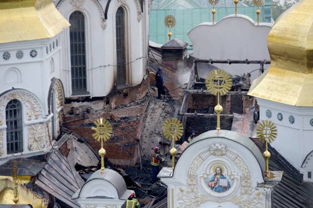 Massive Russian Attack Damages Kyiv Pechersk Lavra and Mystetskyi Arsenal - Kyiv A firefighter works on the roof of the Dormition Cathedral at the Kyiv Pechersk Lavra that caught fire during a massive Russian combined attack, Kyiv, Ukraine, June 15, 2026. The Russian army launched a large-scale assault on the Ukrainian capital with missiles and strike drones, killing four people and injuring 28, including children and a pregnant woman. At least 140,000 consumers were left without electricity due to damage to power grids. Residential buildings, the Kyiv Pechersk Lavra, the Mystetskyi Arsenal Museum Complex, the Dovzhenko Film Studio, and the building of the High Anti-Corruption Court sustained damage. (Photo by Marianna Kotyk Ukrinform ABACA Copyright: xUkrinform ABACAx