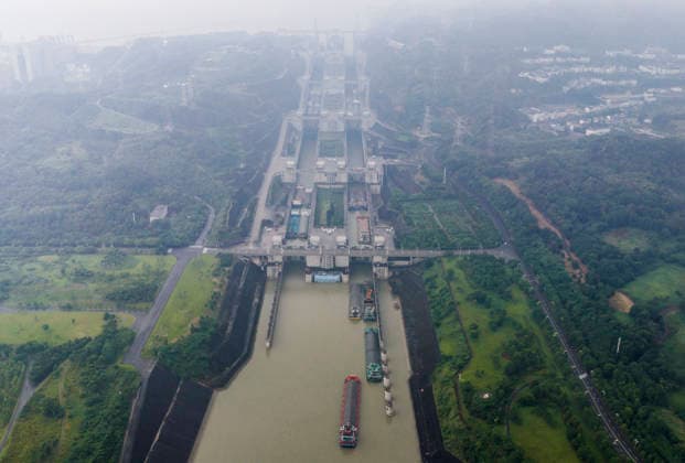 (260618) -- YICHANG, June 18, 2026 -- An aerial drone photo taken on June 18, 2026 shows ships passing through the dual-channel five-tier ship locks of the Three Gorges Dam in Yichang, central China s Hubei Province. Thursday marks the 23rd anniversary of the operation of the ship locks of the Three Gorges Dam, the world s largest hydropower project. Over the past 23 years, the ship locks have handled over 1.11 million vessels, and facilitated a total freight volume of 2.4 billion tonnes, according the China Three Gorges Corporation. (Photo by Xinhua) CHINA-HUBEI-YICHANG-THREE GORGES DAM-23 YEARS-CARGO THROUGHPUT (CN) ZhengxJiayu