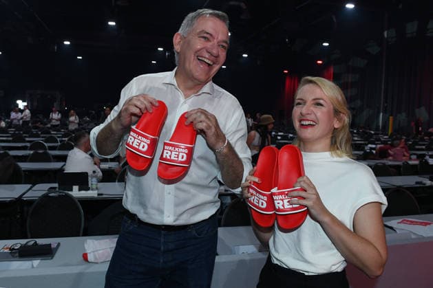 10th National Party Convention of Die Linke on June 19, 2026, at the Metropolis Halle in Potsdam; a tour of the venue with party leaders Jan van Aken, chair of Die Linke, on the left, Ines Schwerdtner, Party Chair of Die Linke, and on the right, flip-flops bearing the inscription Walking Red ,detected_source_language xRx