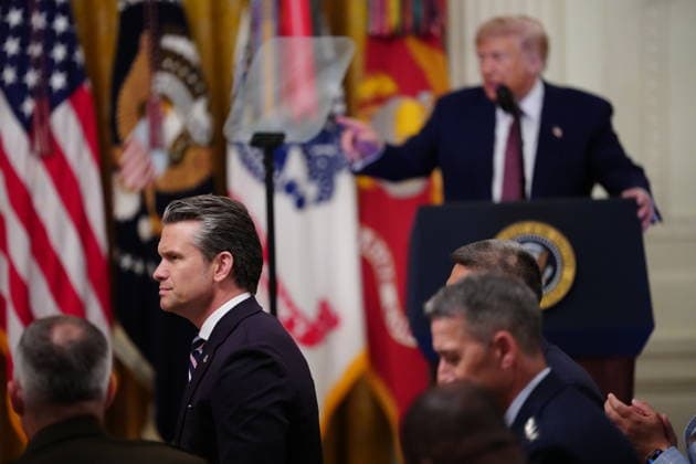 United States Secretary of War Pete Hegseth looks on as US President Donald J Trump makes remarks as he awards the Medal of Honor to Major James Capers, Jr, US Marine Corps (Retired); Colonel John W. Ripley, US Marine Corps (Posthumous); and Major Nicholas Dockery, US Army (Retired) during a ceremony in the East Room of the White House in Washington, DC, USA, on Thursday, June 18, 2026. Copyright: xAaronxSchwartzx xPoolxviaxCNPx MediaPunchx