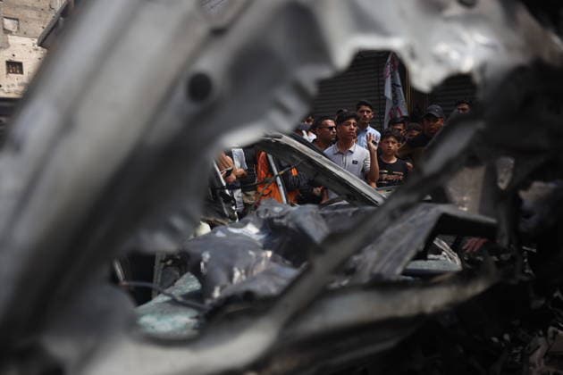 Palestinians Inspect Damaged Vehicles At The Site Of An Israeli Strike Palestinians inspect damaged vehicles at the site of an Israeli military operation in Gaza City, on June 22, 2026. Gaza Palestine  Copyright: xMajdixFathix originalFilename: fathi-notitle260622_npRdm