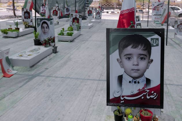 Iran Minab School Airstrikes Aftermath June 2026 Framed portraits of children rest on graves at a cemetery in Minab, Hormozgan Province, Iran, on June 6, 2026. The victims were killed when the Shajareh Tayyebeh Elementary School was hit by a missile strike on February 28, 2026, marking the first day of the USA-Israel war against Iran. The attack killed 156 civilians, including 120 schoolchildren. Minab Hormozgan Iran Copyright: xLaurinxStrelex