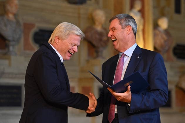 Oliver KAHN, a former professional soccer player, receives the Bavarian Order of Merit from Markus SOEDER, Minister-President of Bavaria and Chairman of the CSU. The award ceremony for the Bavarian Order of Merit took place at the Antiquariat der Residenz in Munich on July 3, 2026.