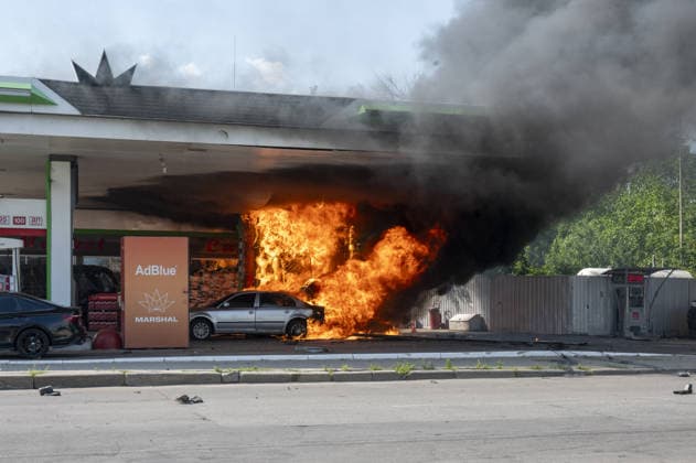 Aftermath of Russian UAV strike in Kharkiv KHARKIV, UKRAINE - JULY 3: Flames rise from a car and a fuel dispenser following UAV attack by Russia on a gas station near the city center of Kharkiv, Ukraine on July 03, 2026. There were no fatalities in the attack. Serhii Masin Anadolu Kharkivs ka Oblast Ukraine. Editorial use only. Please get in touch for any other usage.  Copyright: x2026xAnadoluxSerhiixMasinx