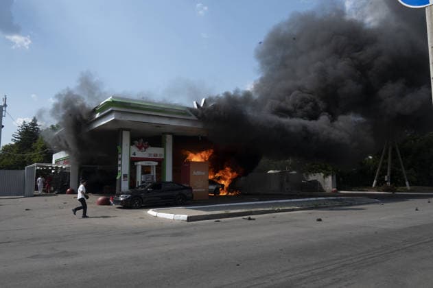 Aftermath of Russian UAV strike in Kharkiv KHARKIV, UKRAINE - JULY 3: Flames rise from a car and a fuel dispenser following UAV attack by Russia on a gas station near the city center of Kharkiv, Ukraine on July 03, 2026. There were no fatalities in the attack. Serhii Masin Anadolu Kharkivs ka Oblast Ukraine. Editorial use only. Please get in touch for any other usage.  Copyright: x2026xAnadoluxSerhiixMasinx