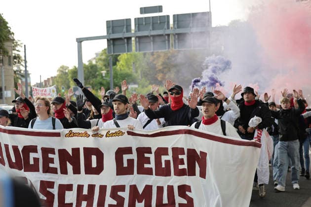 July 4, 2026: Protest against the AfD party convention in Erfurt. A protest march with banners and fireworks on its way to the Erfurt Exhibition Hall, Erfurt, Thuringia