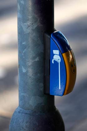 Düsseldorf, Germany, September 6, 2023 Traffic signal systems for blind and visually impaired people—known as traffic lights for the blind —are equipped with special additional features which ensure safe crossing of the street. They feature audible and tactile signals on the yellow traffic signal boxes at a crosswalk in Düsseldorf-Mörsenbroich.