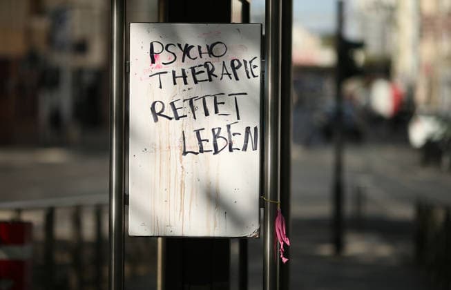 On a sign at a shelter at a subway station in Cologne, the words Psychotherapy Saves Lives were written in marker. Cologne, North Rhine-Westphalia