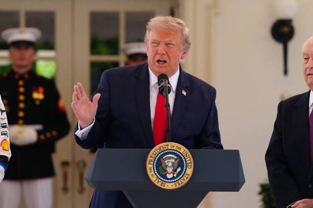 United States President Donald J Trump makes remarks as he hosts top IndyCar drivers at the White House in Washington, DC, USA, to promote the inaugural Freedom 250 Grand Prix on Monday, July 13, 2026. The race will be held in DC on August 22-23, 2026. Looking on from right is IndyCar series owner Roger Penske. Credit: CNP AdMedia Washington District of Columbia United States of America EDITORIAL USE ONLY  Copyright: xx AdMediax admphotosthree005105