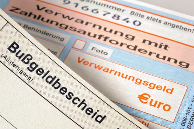 Traffic ticket with a warning; notice of fine and traffic ticket used as a stock image representing a violation of the STVO (German Road Traffic Regulations) FOR EDITORIAL USE ONLY