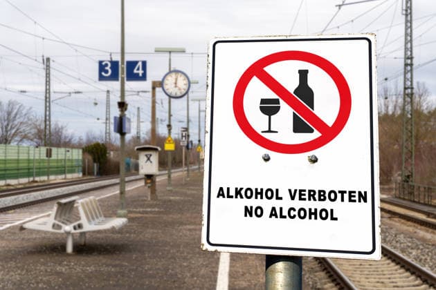 Germany - July 22, 2026: PHOTOMONTAGE, sign at the train station: ALCOHOL PROHIBITED, NO ALCOHOL. Deutsche Bahn (DB) is gradually implementing a nationwide ban on alcohol consumption at its train stations. The ban applies to platforms and station concourses, but not to food and beverage establishments