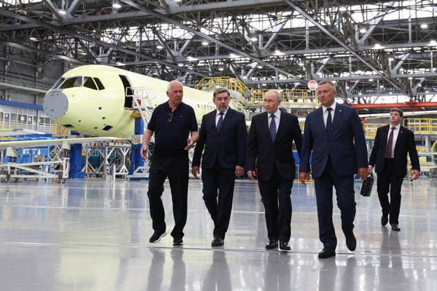 RUSSIA, IRKUTSK - JULY 24, 2026: Sergei Chemezov, Rostec CEO, Andrei Soinov, Irkutsk Aviation Plant CEO, Vladimir Putin, President of Russia, and Igor Kobzev (L-R front), Irkutsk Region Governor, visit the Irkutsk Aviation Plant owned by Rostec s United Aircraft Corporation. Vyacheslav Prokofyev Russian Presidential Press and Information Office TASS  95394736