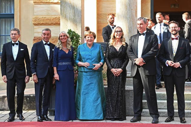 From left: Joachim SAUER, Michel FRIEDMANN, Karin BAUMUELLER SOEDER, Angela MERKEL, former German Chancellor, Katharina WAGNER, Markus SOEDER, Minister-President of Bavaria and CSU Chairman, Andreas ZIPPEL, Mayor of Bayreuth, Opening of the 2026 Bayreuth Richard Wagner Festival, Red carpet on July 25, 2026, at the Green Hill,