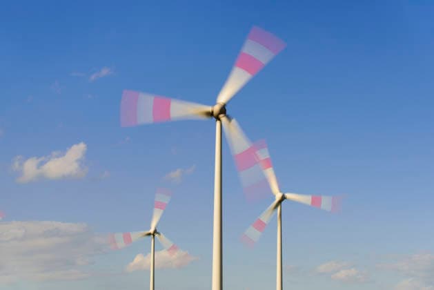 Wind turbine in motion Wind turbine in motion as a symbolic image of energy generation using green electricity DIGITALLY EDITED FOR EDITORIAL USE ONLY