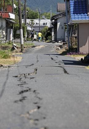 Aftermath of strong earthquake in Kumamoto A warped and cracked road is pictured in Uki, Kumamoto Prefecture, on July 31, 2026, three days after a powerful earthquake struck the southwestern Japan prefecture.  A14AA0005624702P