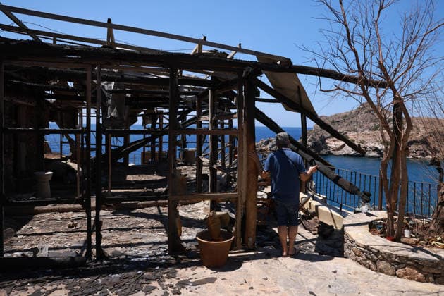 Aftermath of the devastating Crete wildfire CRETE, GREECE - JULY 31: Vangelis Datseris, the receptionist of a hotel damaged by the wildfire, walks through the hotel s premises after a wildfire at the village of Agios Pavlos, in the Rethymno region on the island of Crete, Greece, July 31, 2026. Costas Baltas Anadolu Crete Greece. Editorial use only. Please get in touch for any other usage.  Copyright: x2026xAnadoluxCostasxBaltasx