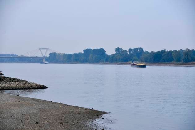 ABB RHINE Rhine navigation channel Low water level Rhine riverbank, near Düsseldorf-Oberkassel Currently, restricted vessel traffic on the Rhine near Oberkassel Rhine Bridge inland waterway vessels cargo ship freight ship transport ship barge currently not fully loaded on the Rhine traveling on the water