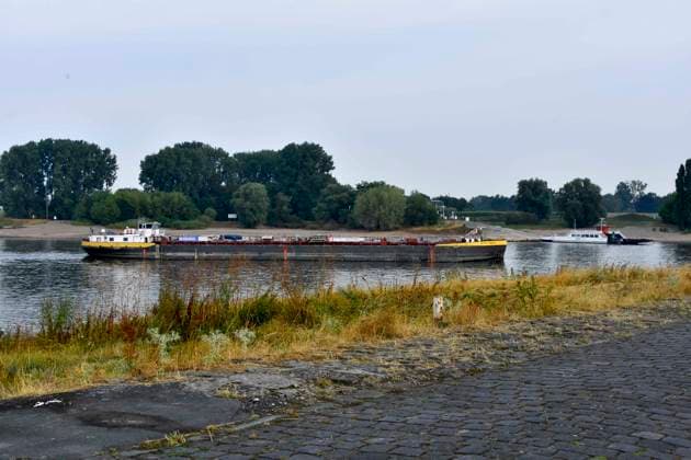 ABB RHEIN Stolt Main is a Type C inland tanker in the Rhine navigation channel on the low-water side of the Rhine, near Düsseldorf-Oberkassel. Currently, vessel traffic on the Rhine near Oberkassel is restricted. Rhine Bridge. Inland waterway vessel, cargo s