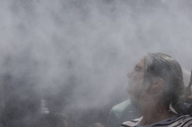 Fourth heatwave in Italy ROME, ITALY, JULY 31: A tourist cools off under mist cannons set by the Civil Protection in front of the Colosseum in Rome, Italy, on July 31, 2026. The fourth heatwave driven by an African anticyclone has hit Italy, with the Health Ministry placing 11 cities under its highest heat alert and expected to add more in the coming days, as temperatures are forecast to exceed 40 degrees Celsius. Riccardo De Luca Anadolu Rome Italy. Editorial use only. Please get in touch for any other usage.  Copyright: x2026xAnadoluxRiccardoxDexLucax