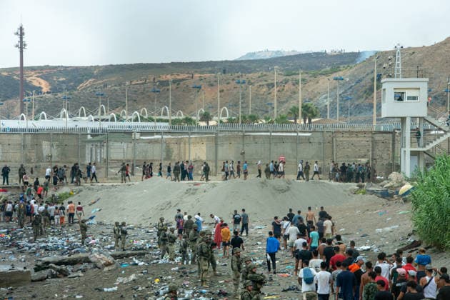 July 31, 2026, Ceuta, Ceuta, Spain: Spanish soldiers control as migrants cross back to Morocco after they crossed the border to enter Spain s north Africa s Ceuta enclave. Ceuta Spain - ZUMAd308 20260731_zsp_d308_021 Copyright: xJuanxCarlosxLucasx