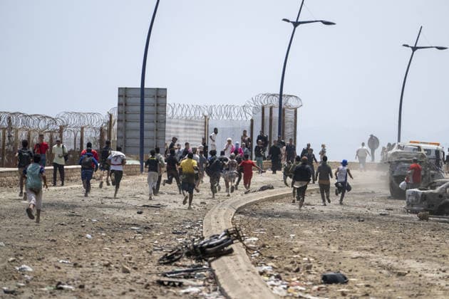 Spain says over 48,300 migrants have returned to Morocco from Ceuta CEUTA, SPAIN - JULY 31: Undocumented migrants, mostly young men, who entered Spain s North African enclave of Ceuta illegally, begin returning to Morocco after realizing their chances of obtaining legal status in Spain are unlikely on July 31, 2026. Meanwhile, small groups of migrants continue trying to cross into Ceuta by swimming or climbing the breakwater surrounding the Fnideq coast. More than 48,300 of the approximately 50,000 migrants who entered the Spanish enclave of Ceuta since early Thursday have returned to Morocco by Friday afternoon, Spain s Interior Ministry said, according to EFE news agency. Abu Adem Muhammed Anadolu Ceuta Spain. Editorial use only. Please  Copyright: x2026xAnadoluxAbuxAdemxMuhammedx
