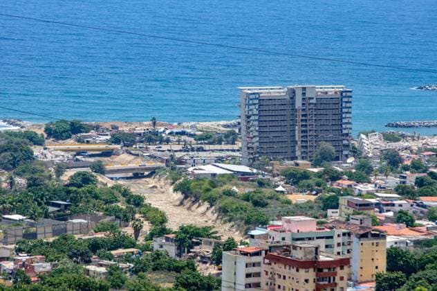 July 31, 2026, La Guaira, Venezuela (Bolivarian Republic of: CARABALLEDA, LA GUAIRA, VENEZUELA Ã¢â‚¬ JULY 30, 2026: Heavy machinery operates in the Caraballeda and Los Corales sectors of La Guaira state as crews carry out debris removal, sanitation work and ground leveling near residential areas. The continuous movement of dump trucks and earthmoving equipment reflects ongoing efforts to clear affected areas and prepare the terrain for recovery operations. La Guaira Venezuela (Bolivarian Republic of - ZUMAq101 20260731_zna_q101_245 Copyright: xMarioxFloresx