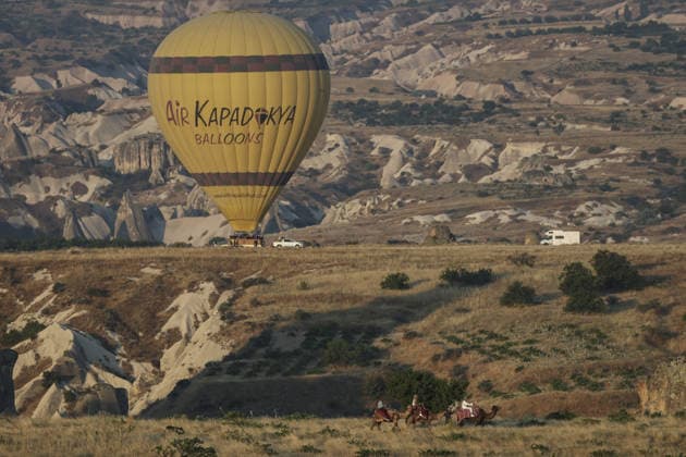 7th Cappadocia Balloon Festival NEVSEHIR, TURKIYE - AUGUST 01: Figure-shaped hot air balloons float above Cappadocia s fairy chimneys during the seventh Cappadocia Balloon Festival, on August 01, 2026 in Nevsehir, Turkiye. Organized by the Ministry of Culture and Tourism, the festival features 30 specially designed balloons brought from Turkiye and several other countries. During sunrise demonstration flights over Goreme, balloons shaped like hearts, owls, parrots, rockets and the Earth attracted the attention of local and international visitors. Osmancan Gurdogan Anadolu Nevsehir Turkey. Editorial use only. Please get in touch for any other usage.  Copyright: x2026xAnadoluxOsmancanxGurdoganx