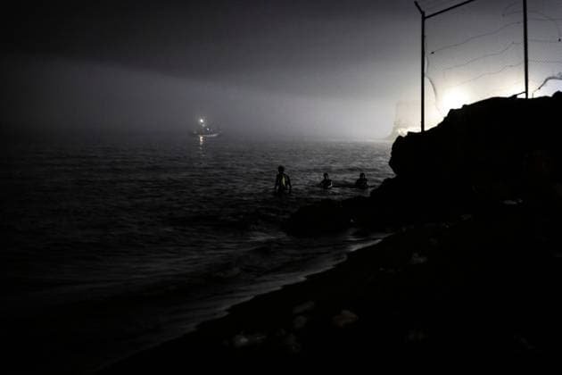 August 1, 2026, Ceuta, Spain: CEUTA, SPAIN - AUGUST 1, 2026: The arrival of migrants across the Tarajal border continues during the early hours of Saturday morning in Ceuta. Authorities maintain security and monitoring devices at the border crossing amid the ongoing influx. Ceuta Spain  - ZUMAq101 20260801_zna_q101_061 Copyright: xSamuelxVegax