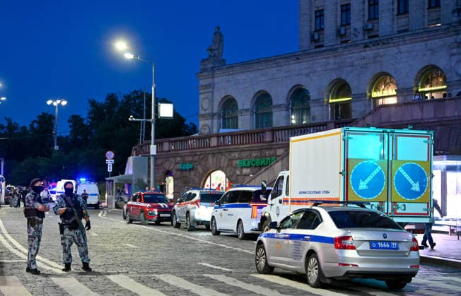 (260801) -- MOSCOW, Aug. 1, 2026 -- Security personnel work at the site of an explosion in Moscow, Russia, Aug. 1, 2026. Three people were killed and 21 others injured after an improvised explosive device detonated at a restaurant in central Moscow, Russia s National Anti-Terrorism Committee (NAC) said Saturday. According to the NAC, a woman attempted to bring the explosive device into the restaurant located near Kudrinskaya Square. She was killed when the device detonated. (Photo by Alexander Zemlianichenko Jr Xinhua) RUSSIA-MOSCOW-EXPLOSION FengxKaihua 