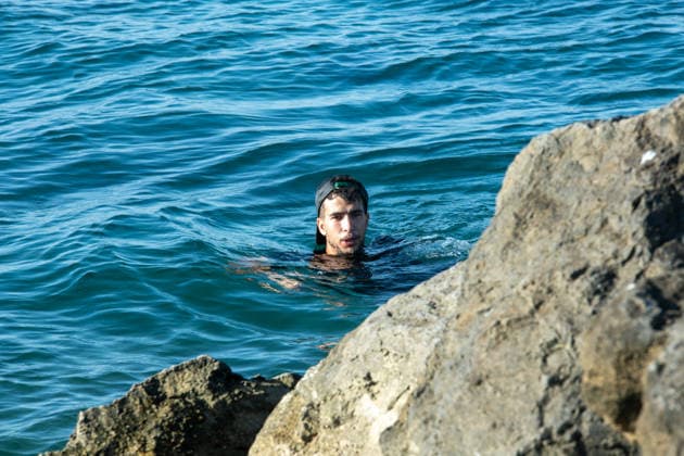 August 2, 2026, Ceuta, Madrid, Spain: A migrant attempts to swim across the border under the watchful eye of the Spanish Civil Guard at El Tarajal beach in Ceuta, Spain, August 2, 2026. Ceuta Spain - ZUMAd308 20260802_zsp_d308_012 Copyright: xJuanxCarlosxLucasx