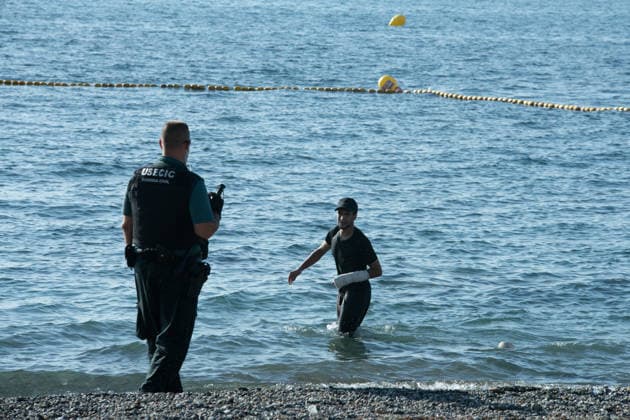 August 2, 2026, Ceuta, Madrid, Spain: A migrant attempts to swim across the border under the watchful eye of the Spanish Civil Guard at El Tarajal beach in Ceuta, Spain, August 2, 2026. Ceuta Spain  - ZUMAd308 20260802_zsp_d308_021 Copyright: xJuanxCarlosxLucasx