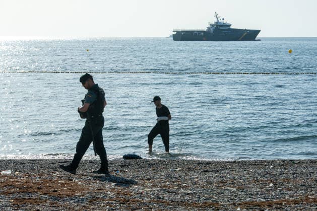 August 2, 2026, Ceuta, Madrid, Spain: A migrant attempts to swim across the border under the watchful eye of the Spanish Civil Guard at El Tarajal beach in Ceuta, Spain, August 2, 2026. Ceuta Spain  - ZUMAd308 20260802_zsp_d308_024 Copyright: xJuanxCarlosxLucasx