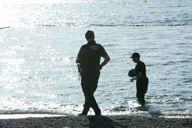 August 2, 2026, Ceuta, Madrid, Spain: A migrant attempts to swim across the border under the watchful eye of the Spanish Civil Guard at El Tarajal beach in Ceuta, Spain, August 2, 2026. Ceuta Spain - ZUMAd308 20260802_zsp_d308_025 Copyright: xJuanxCarlosxLucasx