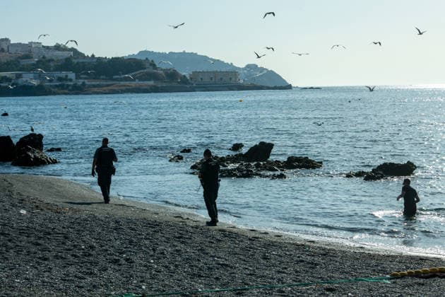 August 2, 2026, Ceuta, Madrid, Spain: A migrant attempts to swim across the border under the watchful eye of the Spanish Civil Guard at El Tarajal beach in Ceuta, Spain, August 2, 2026. Ceuta Spain - ZUMAd308 20260802_zsp_d308_029 Copyright: xJuanxCarlosxLucasx
