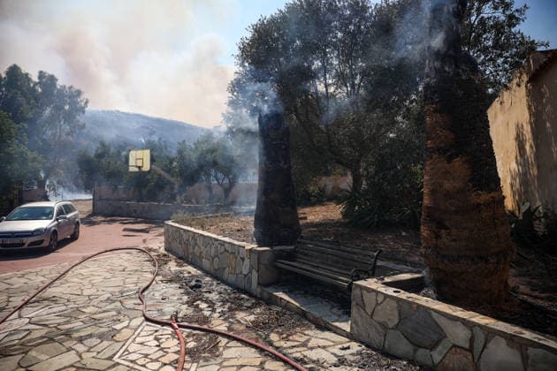 Wildfire in Greece s Megara region MEGARA, GREECE - AUGUST 3: Firefighters operate on the ground as a wildfire continues to burn for a third consecutive day in the Megara region, west of Athens, Greece on August 3, 2026. Emergency services are working to contain the blaze amid challenging weather conditions across the area. Aris Oikonomou Anadolu Megara Greece. Editorial use only. Please get in touch for any other usage.  Copyright: x2026xAnadoluxArisxOikonomoux